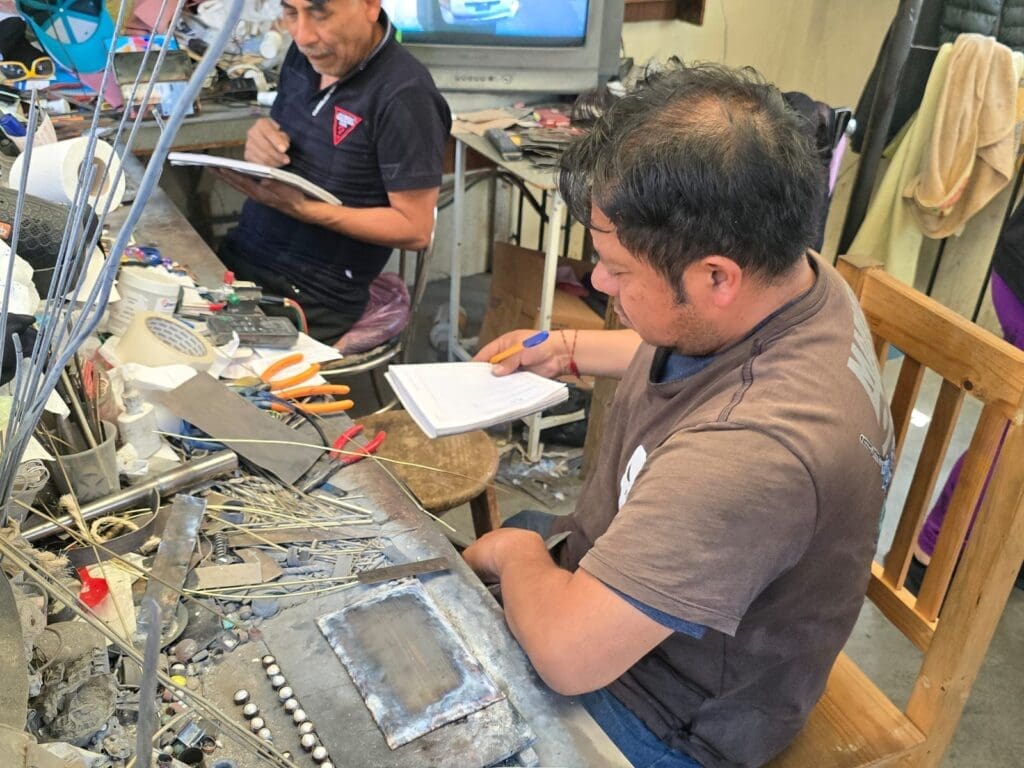 Germán and Pedro Zurita meticulously plan and refine every detail. Surrounded by tools and materials, their expertise ensures each piece maintains the quality and craftsmanship passed down through generations. (Photo courtesy Gabriela Torres Zaragoza)