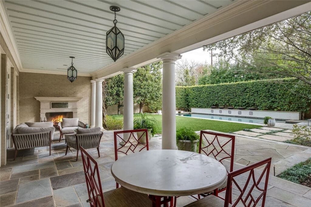 Invite your guests to sip the wine you purchased in Europe last summer around the outdoor fireplace. (Photo by Allie Beth Allman & Associates)