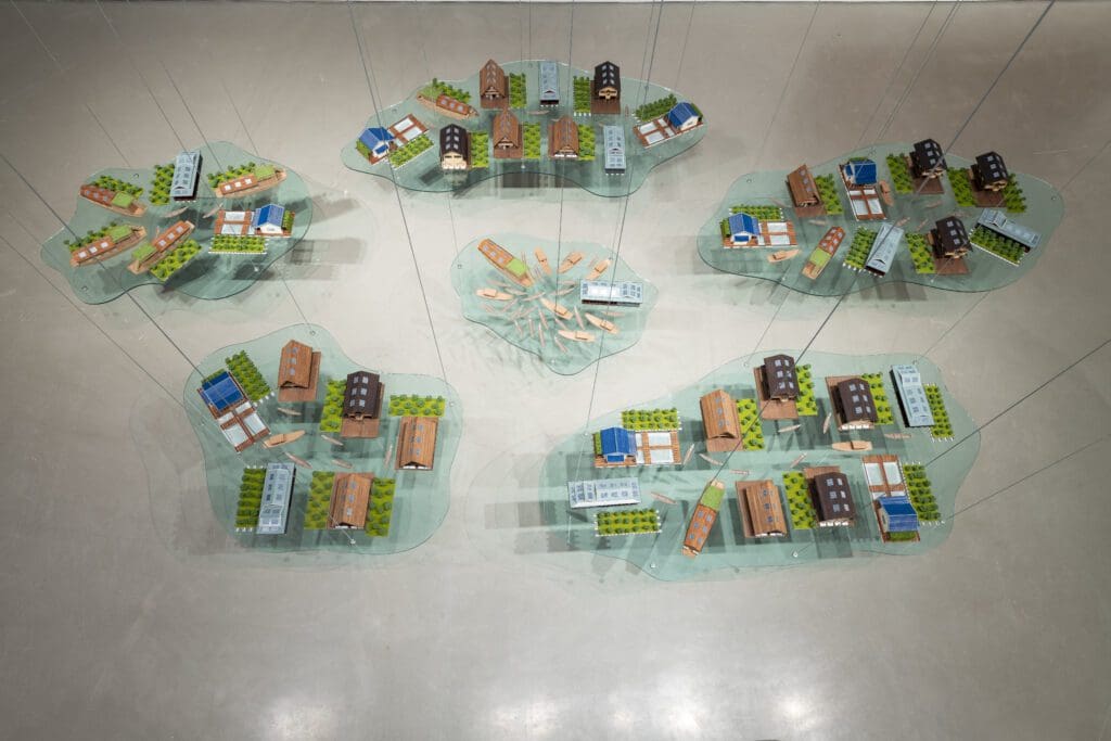 Tiffany Chung's work, featured in the "Breath(e): Toward Climate and Social Justice" exhibit, includes stored in a jar: monsoon, drowning fish, color of water, and the floating world on display. (Photo by Jenny Antill Clifton)