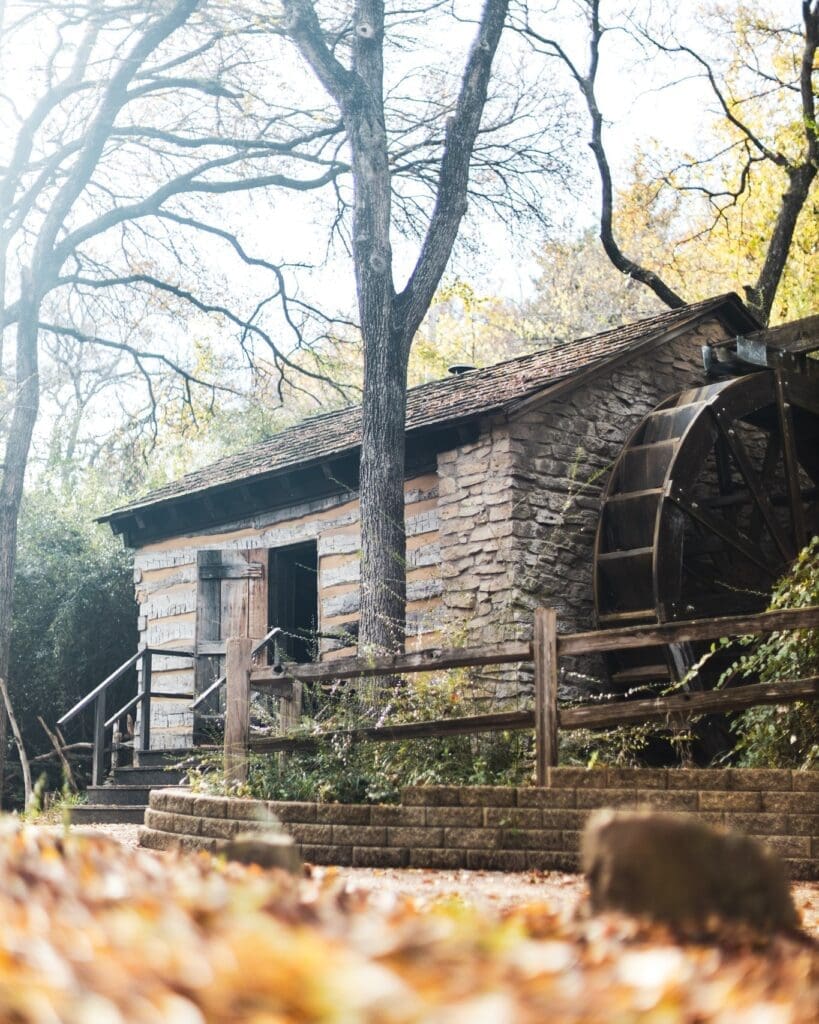 Log Cabin Village brings Texas’ frontier past to life with historic log homes, a working gristmill, and blacksmith demonstrations. (Courtesy)
