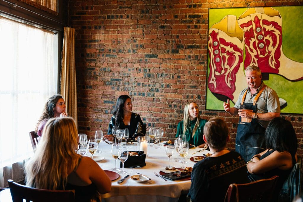 Chef Tim Love walks diners through what they'll experience during the 25-course tasting menu. (Courtesy)