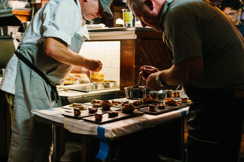 Chef Love and his team prepare courses for the 25-course tasting menu. (Courtesy)