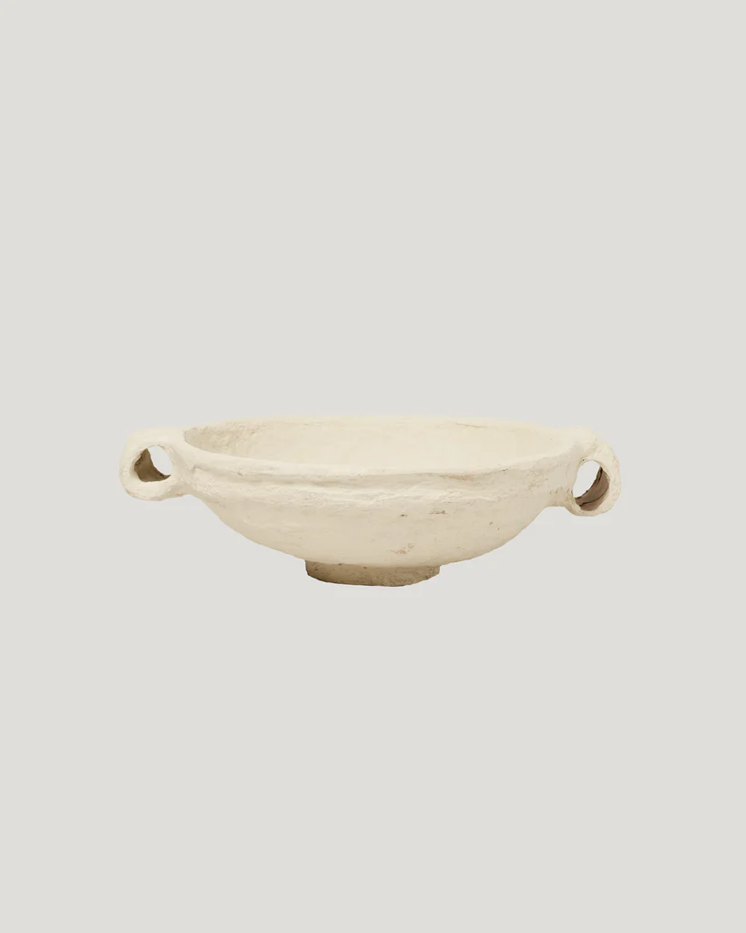 The selection of "found" objects, sourced during the team's extensive travels, includes this paper mache bowl ($275). (Photo by SWOON)
