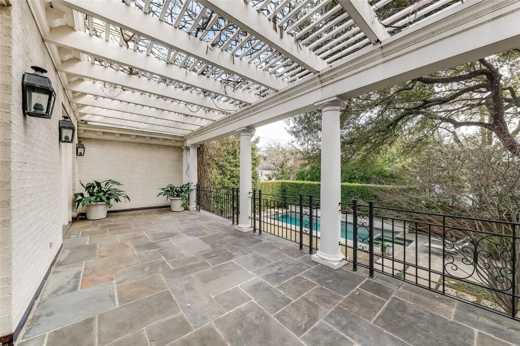 In the morning, throw open the drapes and French doors and take your Miele-brewed coffee on the vine-covered private terrace. (Photo by Allie Beth Allman & Associates)