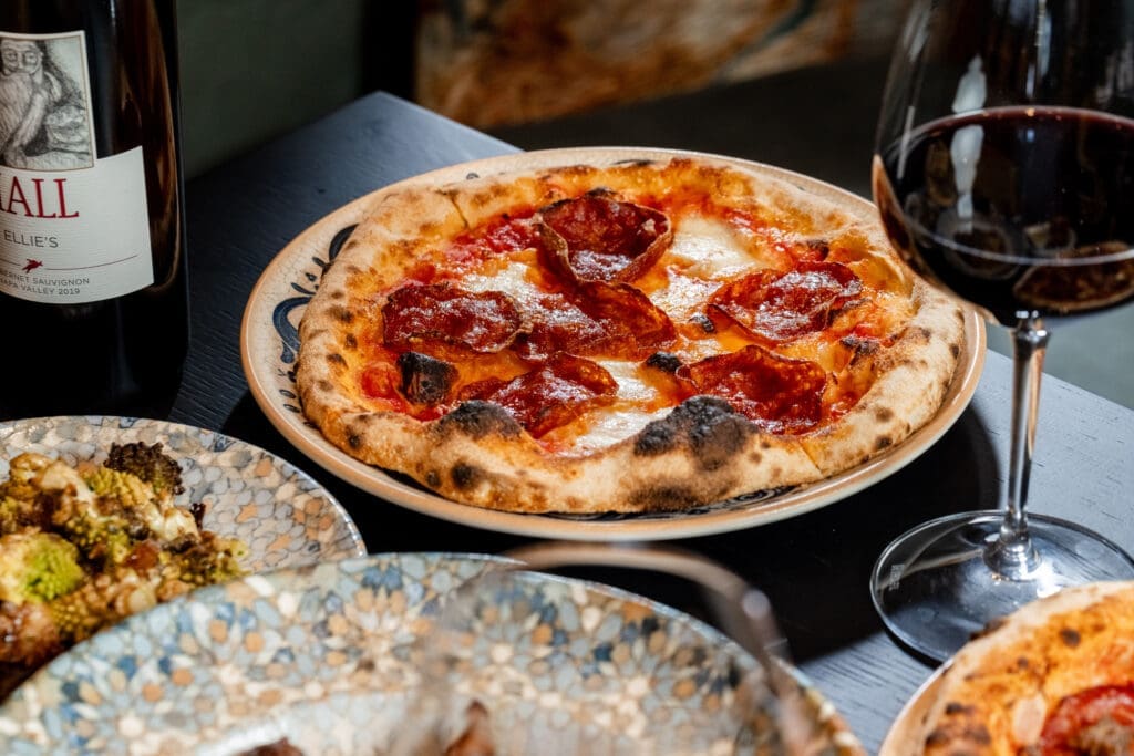 Palato's menu features hearth-fired pizzas. 