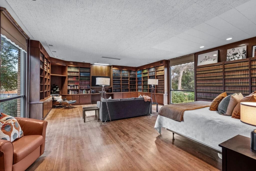 The wood-paneled library near the indoor pool area. (Photo by Compass RE Texas)