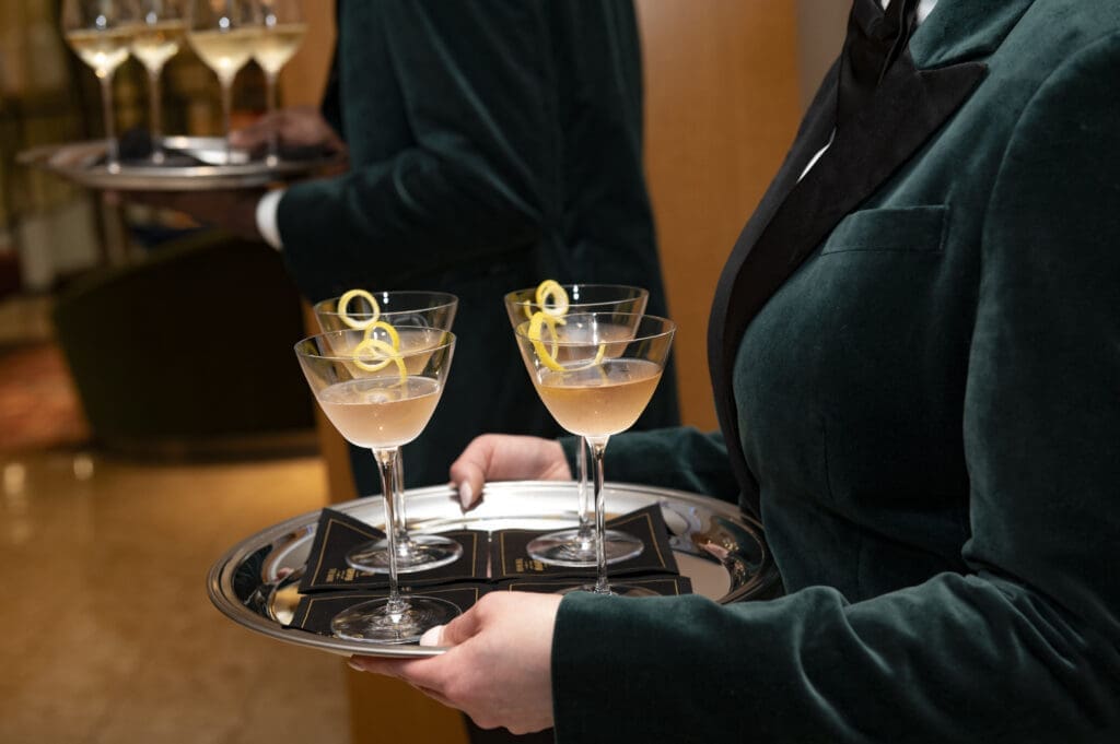 Servers dressed in Caviar Kaspia's green velvet blazers offered vesper martinis. (Photo by Tamytha Cameron )