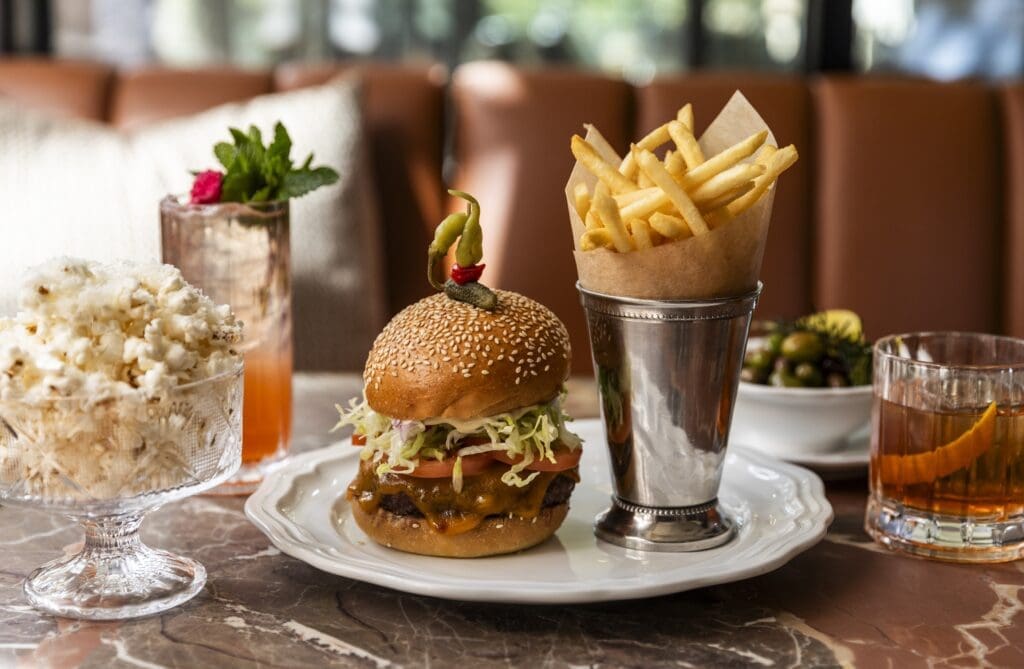 Whether you've checked in at Hotel Granduca and ordered room service or stopped by the bar or restaurant, you can count on the Remi cheeseburger ($22) on a brioche bun. (Photo by Photos by Julie Soefer)