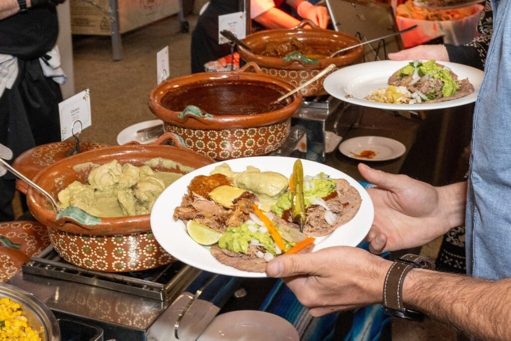 Cazuelas of Mole, Short Rib Pipian Rojo, Chicken Pipian Verde on the lavish buffet at The Houstonian 'Tribute to Mezcal' dinner. (Photo by Jacob Power)