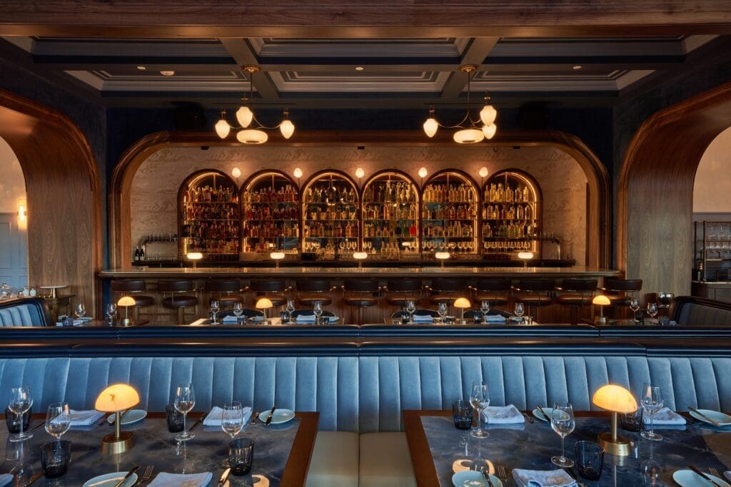 Chardon is a new Houston restaurant where rich walnut millwork surrounds diners ensconced in robin’s egg blue and violet-colored velvet banquettes, its windows dressed in elegant powder blue sheers. (Photo by David Varley)