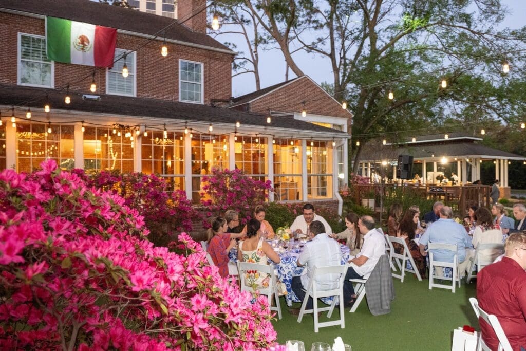 The back lawn of the Manor House with azaleas in bloom provided the perfect setting for the 'Tribute to Mezcal' evening (Photo by Jacob Power)