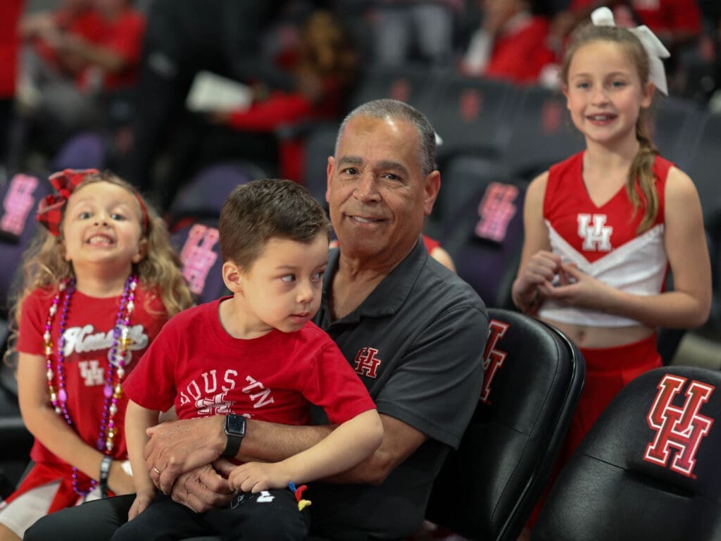 Houston coach Kelvin Sampson always has time for his grandkids Kylen and Maisy Jade Sampson. (Photo by F. Carter Smith)