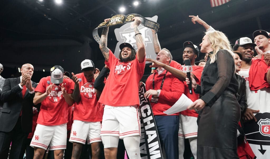 Emanuel Sharp had some fun holding up the championship belt for winning Big 12 MOP. But its his health that's the biggest thrill for Kellvin Sampson's University of Houston team. 
(Photo by Denny Medley/Big 12 Conference)