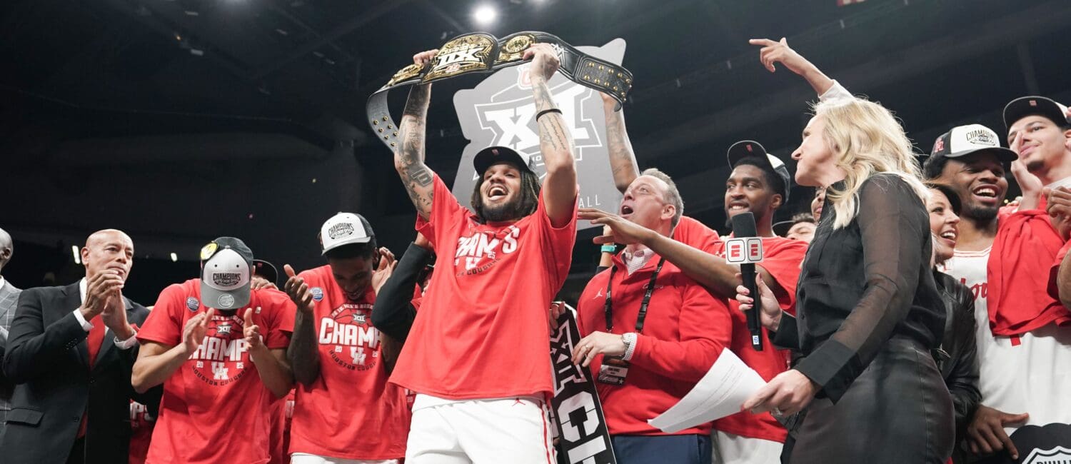 Emanuel Sharp had some fun holding up the championship belt for winning Big 12 MOP. But its his health that’s the biggest thrill for Kellvin Sampson’s University of Houston team.  (Photo by Denny Medley/Big 12 Conference)