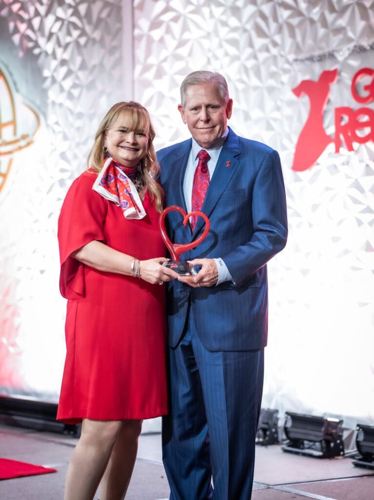 Doreen Griffith, incoming Dallas board chairperson, presented the Sandi Haddock Community Impact Award to Barclay Berdan, Texas Health Resources CEO (Photo by Cash Anglin Photography)