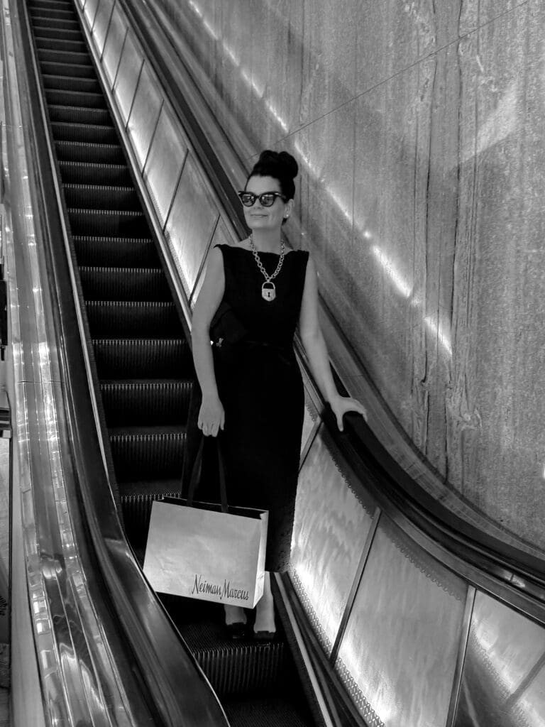 Melissa Smrekar riding the flagship's iconic escalator. (Photo by Lorene Agather)