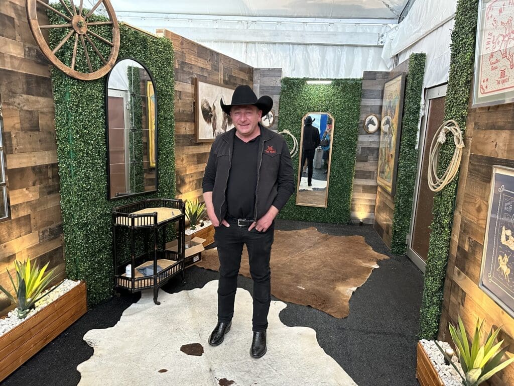 Ben Berg shows off the new restroom at The Ranch + Steakhouse (Photo by Shelby Hodge)