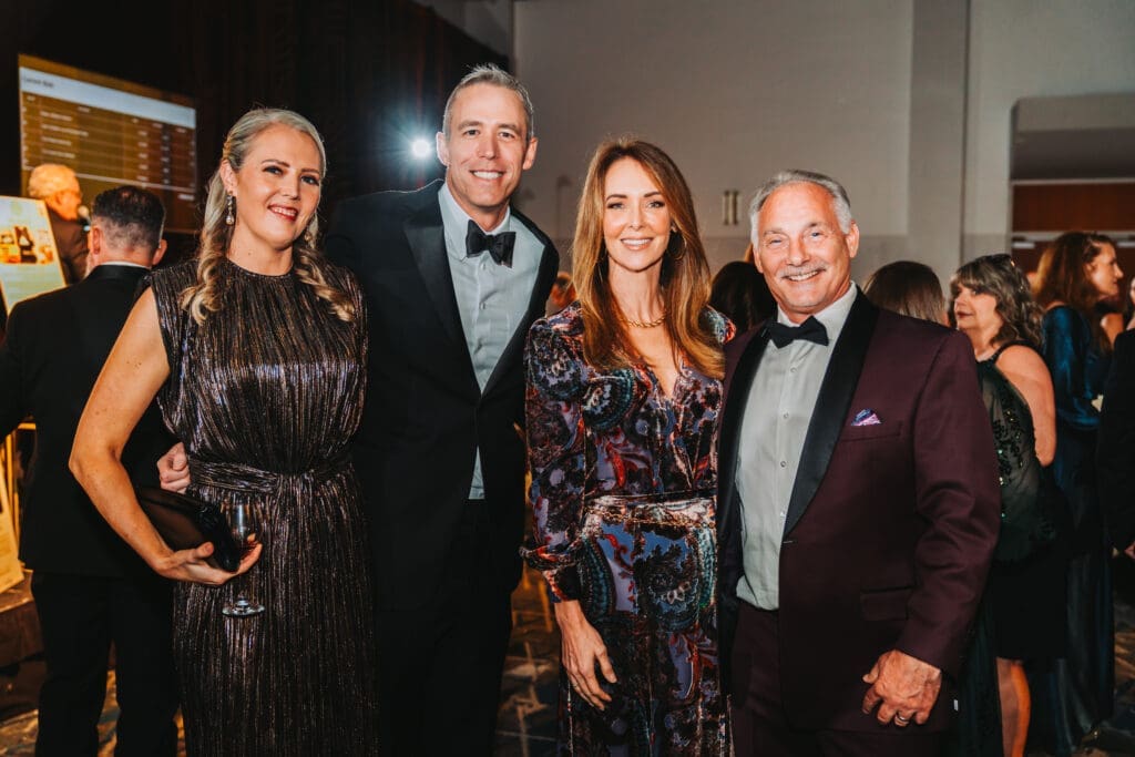 Leigh Ann Carman and Jim Carman with Angela and Bret Strong at the Hometown Heroes Celebration of Excellence gala at The Woodlands Waterway Marriott.  (Photo courtesy of Alexander Cross Photography)