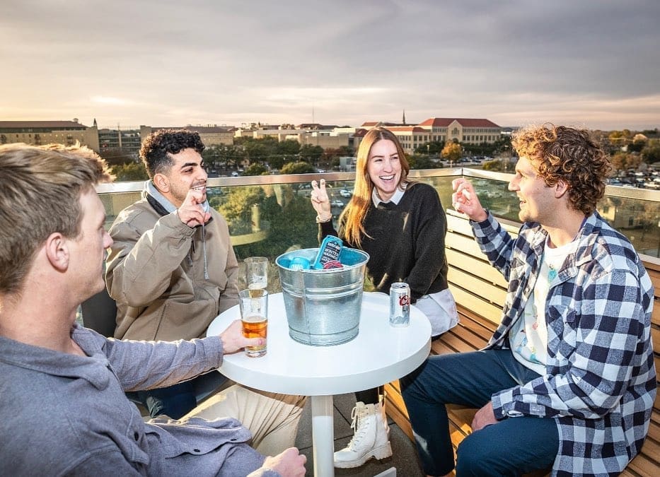 Cheer on the Frogs from above with skyline views and game-day energy just steps from campus. (Courtesy)