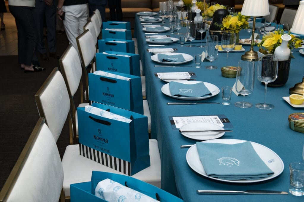 Blue tablecloths, along with the restaurant's branded plates and napkins (flown in for the occasion) transported guests to Caviar Kaspia at The Mark. (Photo by Tamytha Cameron )