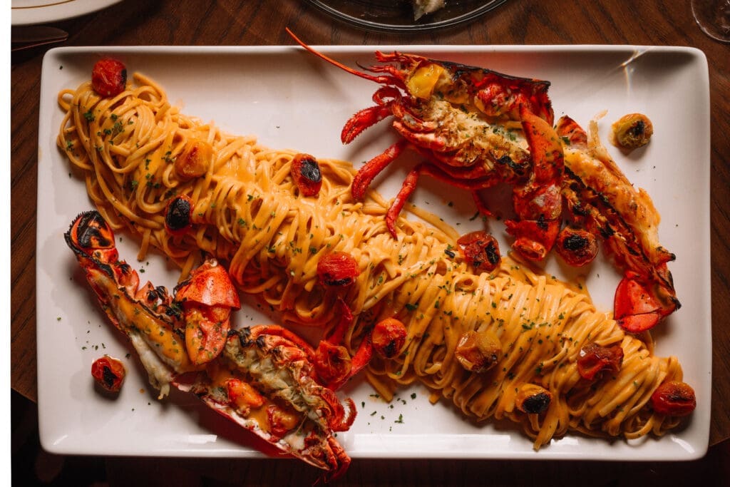 EVELYN entree standouts include a whole Maine lobster linguine. (Photo by Chase Hall)