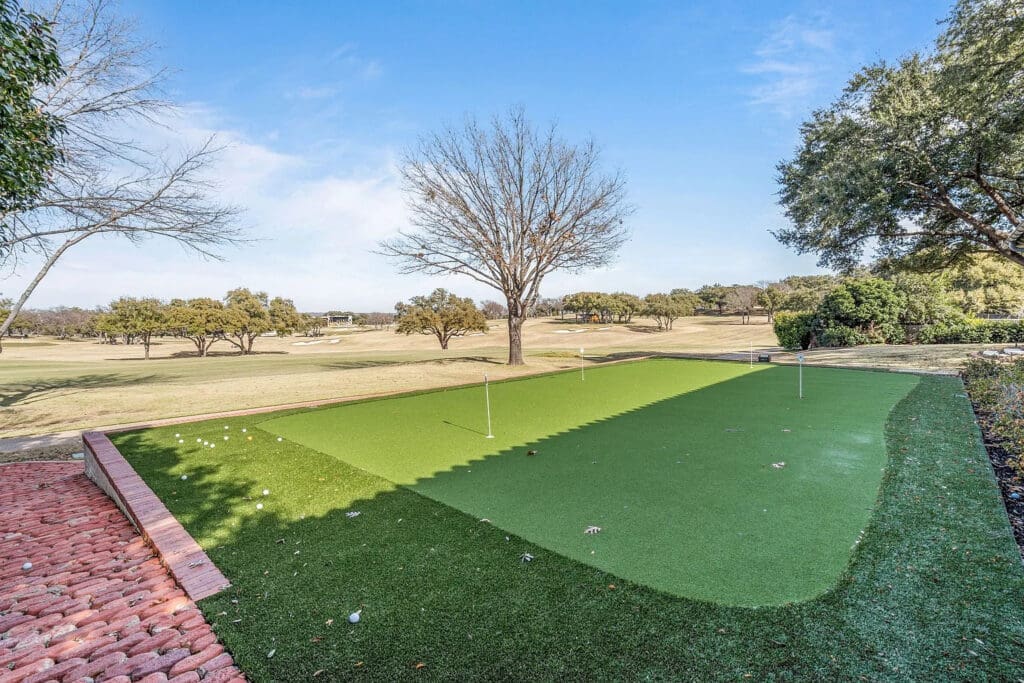 Perfect your short game with a backyard putting green set against the backdrop of the rolling fairways. (Courtesy)