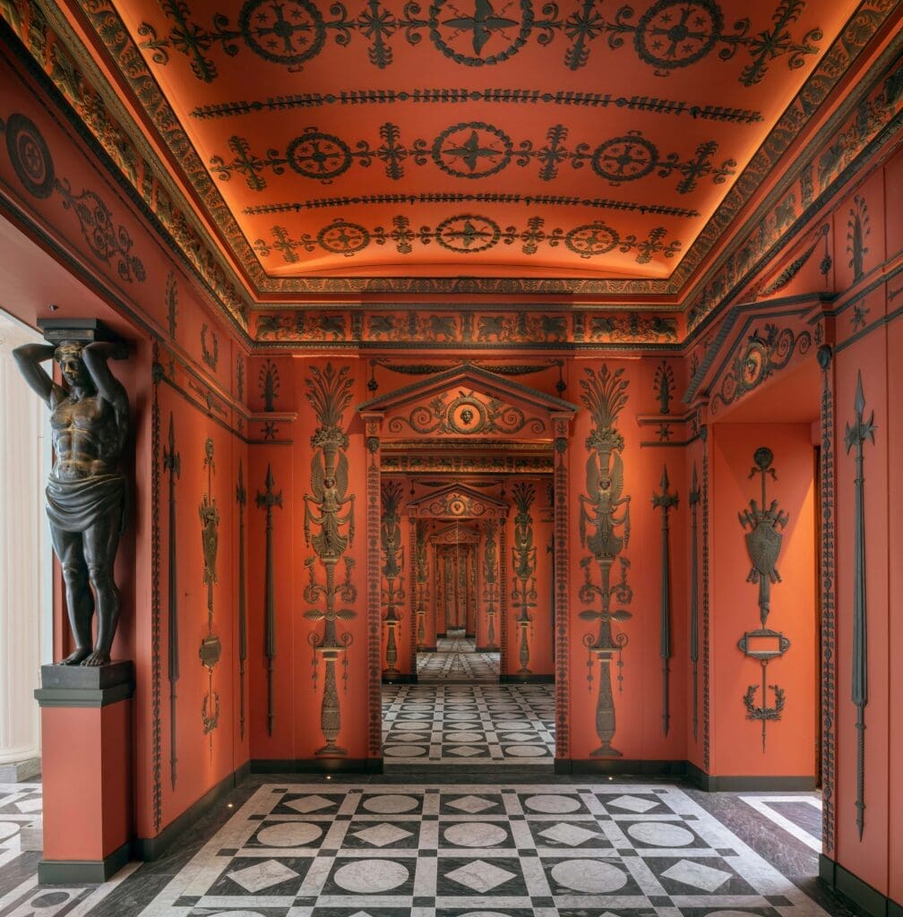 In the vestibule of Féau Boiseries headquarters in Paris, the elaborate hand- carved Etruscan-style rooms were inspired by the original neoclassical decor designed for Napoleon by architects Charles Perrier and Pierre-François Fontaine. (Photo by Jacques Pepión)