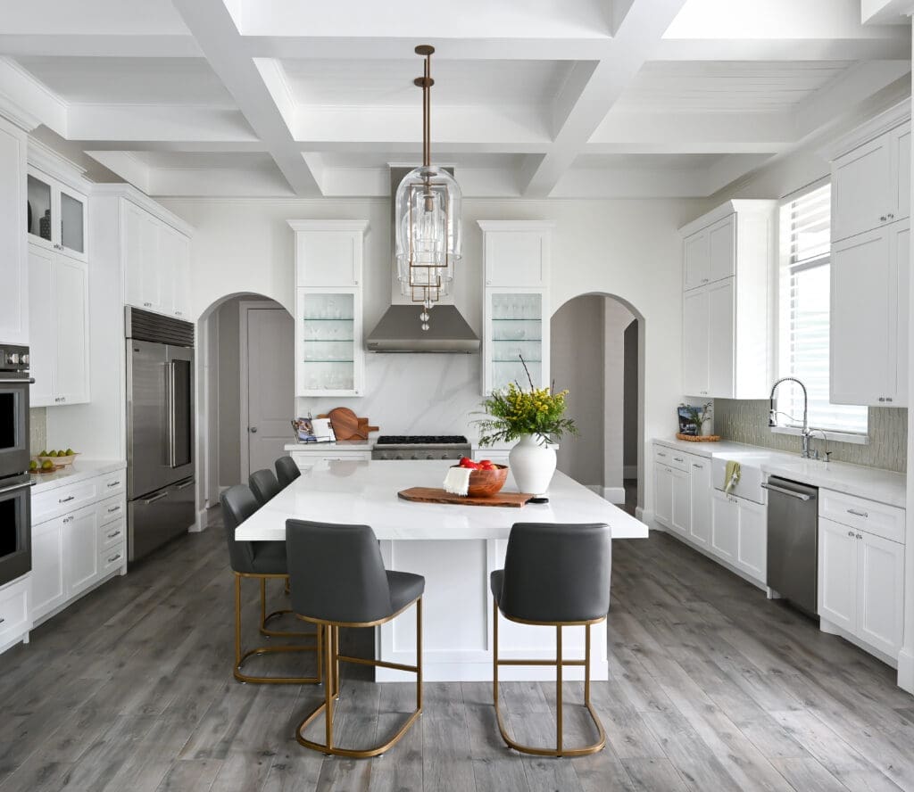 Fresh white coffered ceilings flood the home with natural light. (Photo by Charbonneau Interiors)