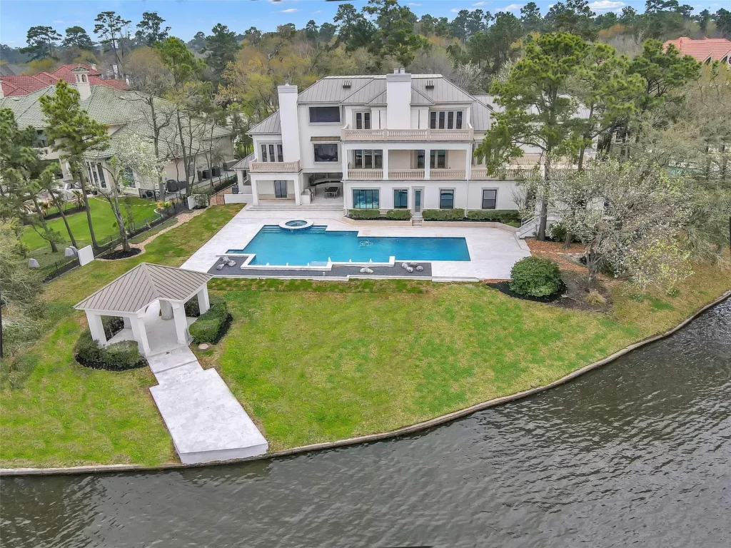 Escape to a retreat in your own backyard as you relax in the pool at 10 W Isle Place just steps away from the waterfront. 