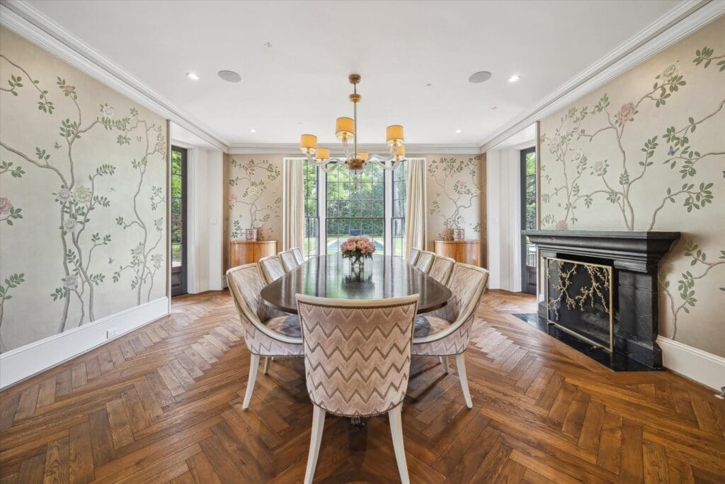 Hand-painted wallpaper in the formal dining room is lighted by jib windows on three sides. (Photo by TK Images)