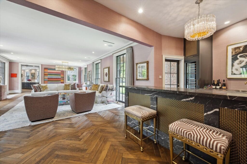 Updates to the original home at 3 Remington Lane include a wet bar and expansive family room. (Photo by TK Images)