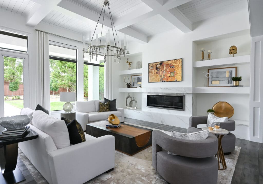 Minimal window treatments filter light without blocking the pool view. The fireplace and shelving were custom-built for the space. (Photo by Charbonneau Interiors)