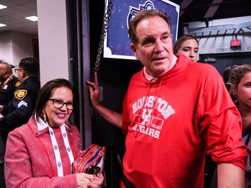 Jim Nantz and Karen Sampson shared a moment after this incredible Houston comeback. (Photo by F. Carter Smith)