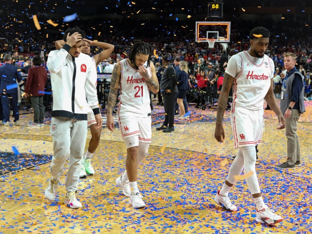 University of Houston players Mercy Miller, Ramon Walker Jr., Emanuel Sharp and Ja'Vier Francis walk off together. (Photo by F. Carter Smith)
