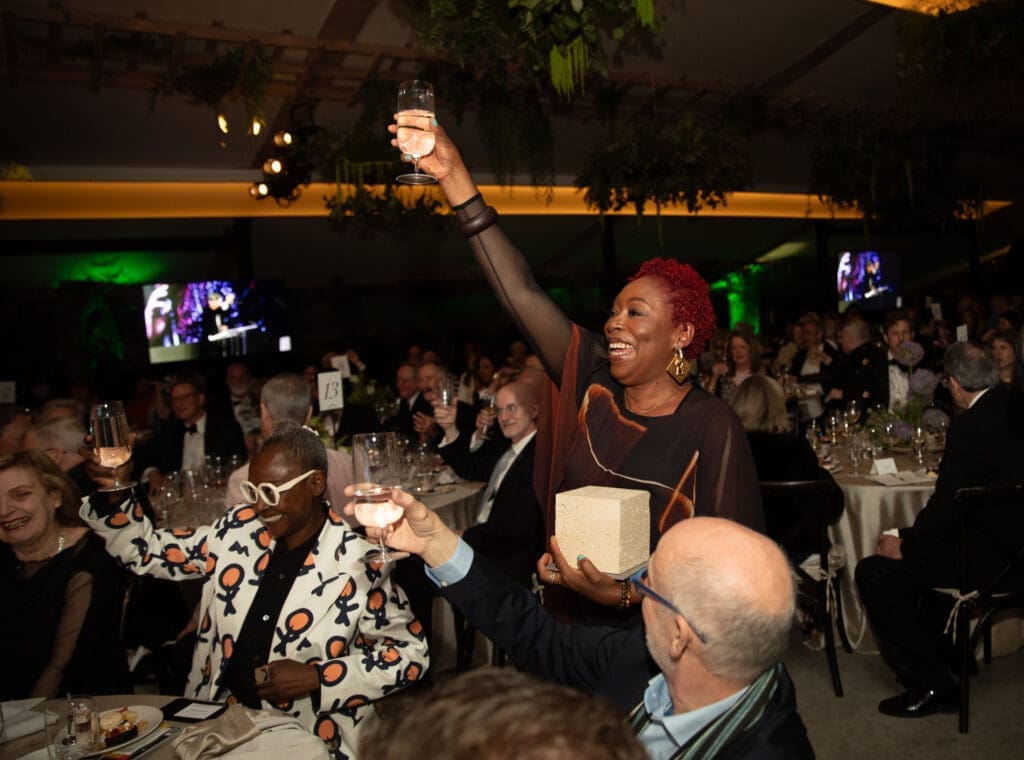 Otobong Nkanga relished this moment in the sun, gleefully and animatedly striking a triumphant pose with her award. (Photo by Exploredinary)