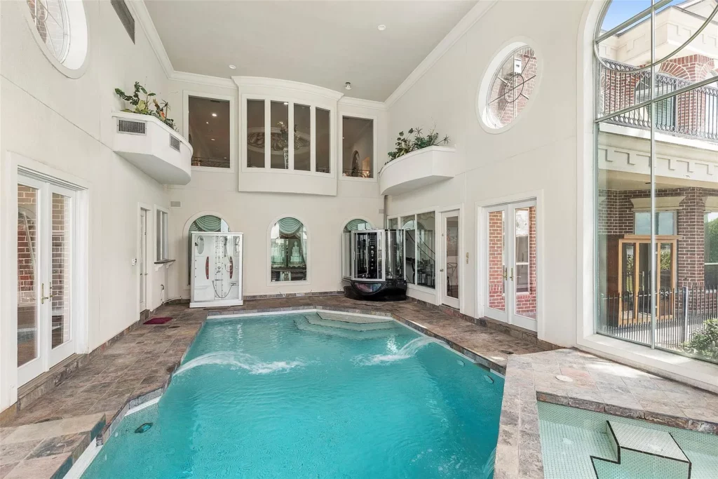The all-season indoor pool and spa at 46 S Windsail Pl is a perfect retreat for those wanting to swim all year. 