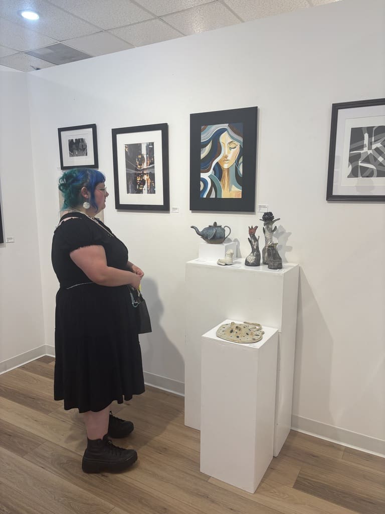 Dean Abilez stands beside her ceramic stingray and other works featured in "Lone Star Rising" at Ardest Gallery. (Photo courtesy Ardest Gallery)