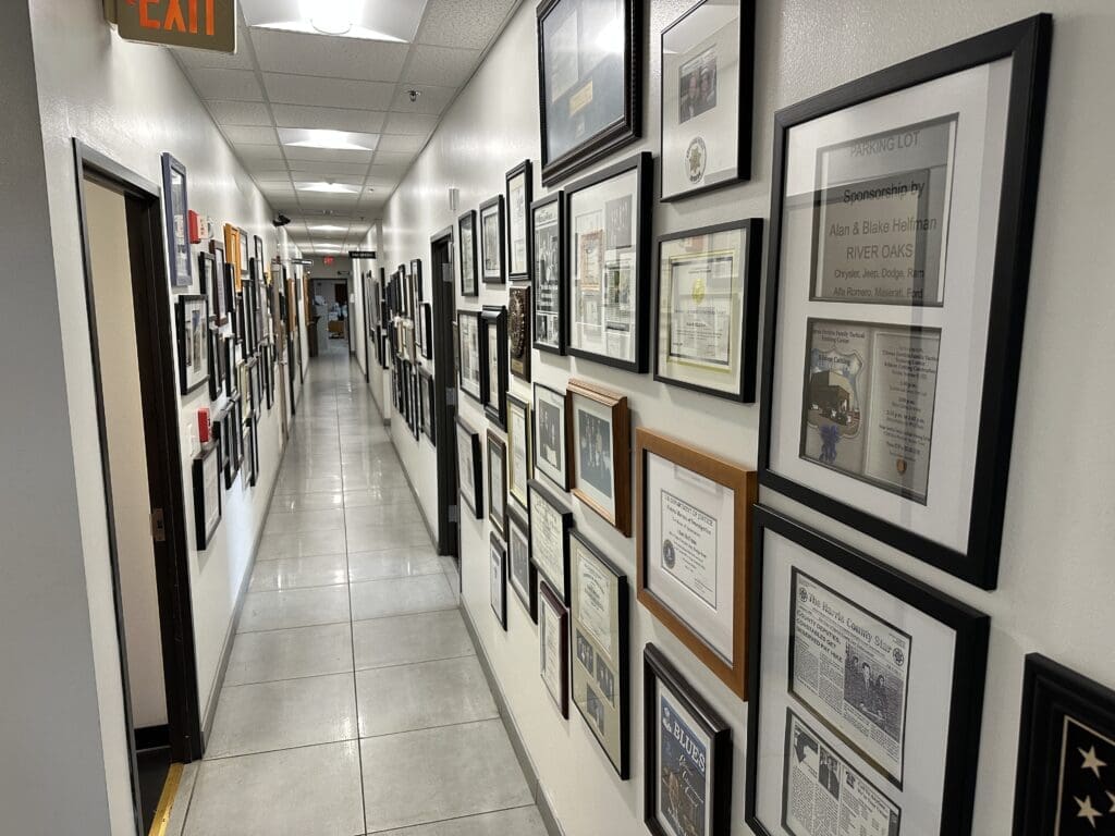 Alan Helfman's office hallways are decorated with plaques from organizations and nonprofits that have benefited from his generosity.