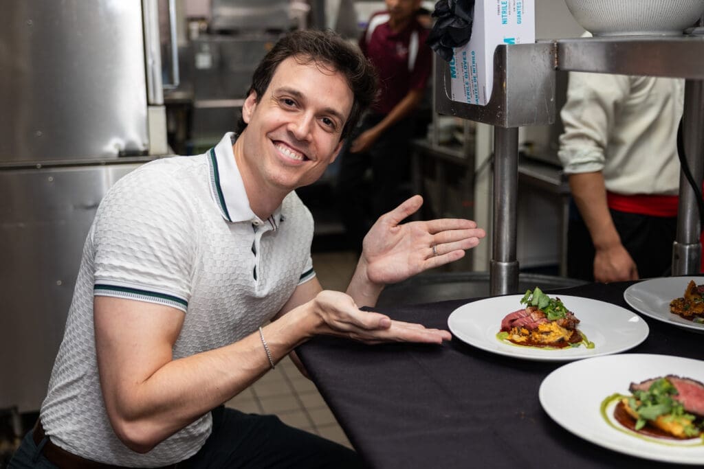 Houston Ballet principal Chase O'Connell poses with the dish he created with Chef Hugo Ortega  for Houston Ballet's 'Raising the Barre.'
 (Photo by Melissa Taylor)