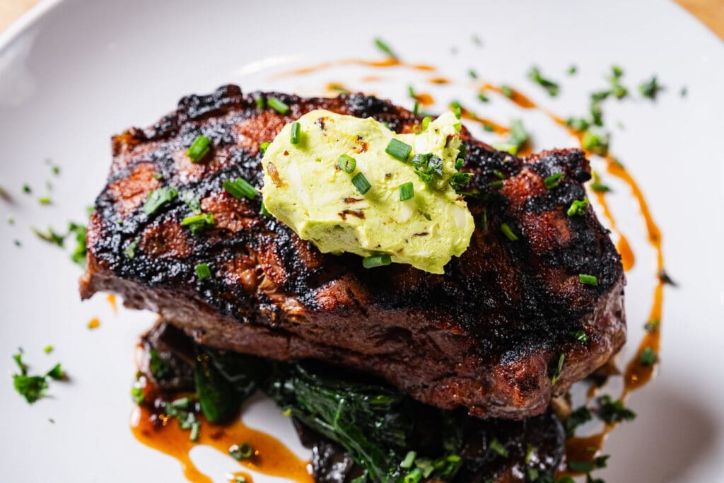 The coffee-rubbed New York strip is a must-order at Cafe Momentum right now. (Photo by Jasonbyg Photography)