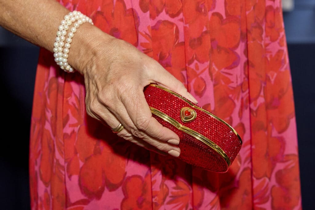 On-theme with a heart-shaped clutch (Photo by Nate Rehlander)