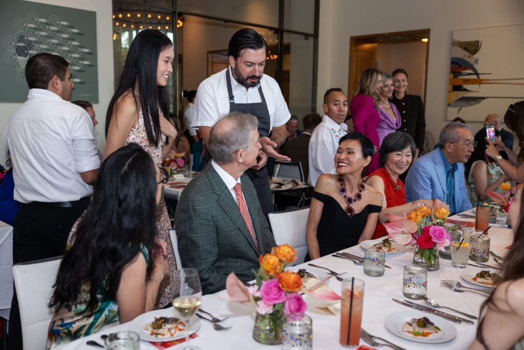 Soloist Danbi Kim, Chef Aaron Bludorn discuss their dish with guests at Houston Ballet's 'Raising the Barre' at Caracol (Photo by Melissa Taylor)
