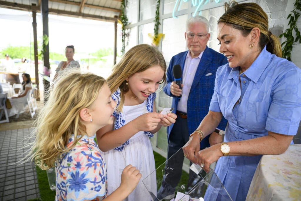 Chair Elizabeth Phillips with kiddos at Fashion in the Fields at Hope Farms benefitting Recipe For Success (Photo Michelle Watson)