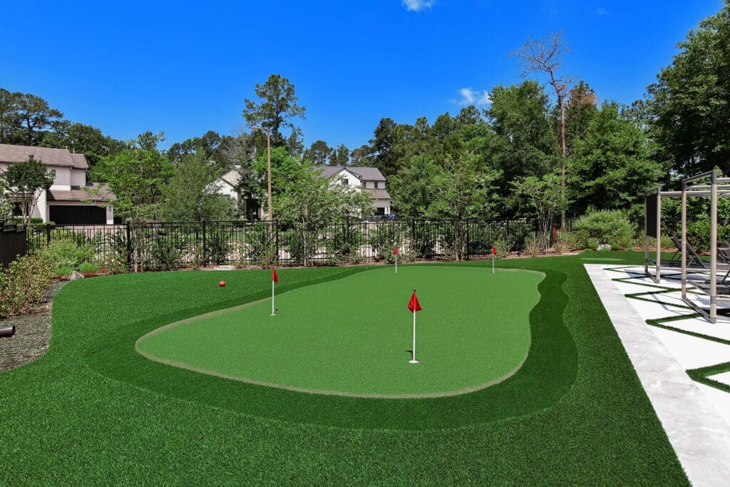 This resort style backyard even includes a putting green.