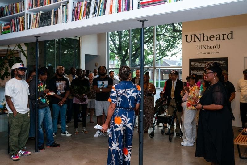 Artist Zsavon Butler addresses the crowd during the opening of her exhibition "UNheard (Unherd)" at Art Is Bond gallery. (Courtesy Art is Bond, Houston)