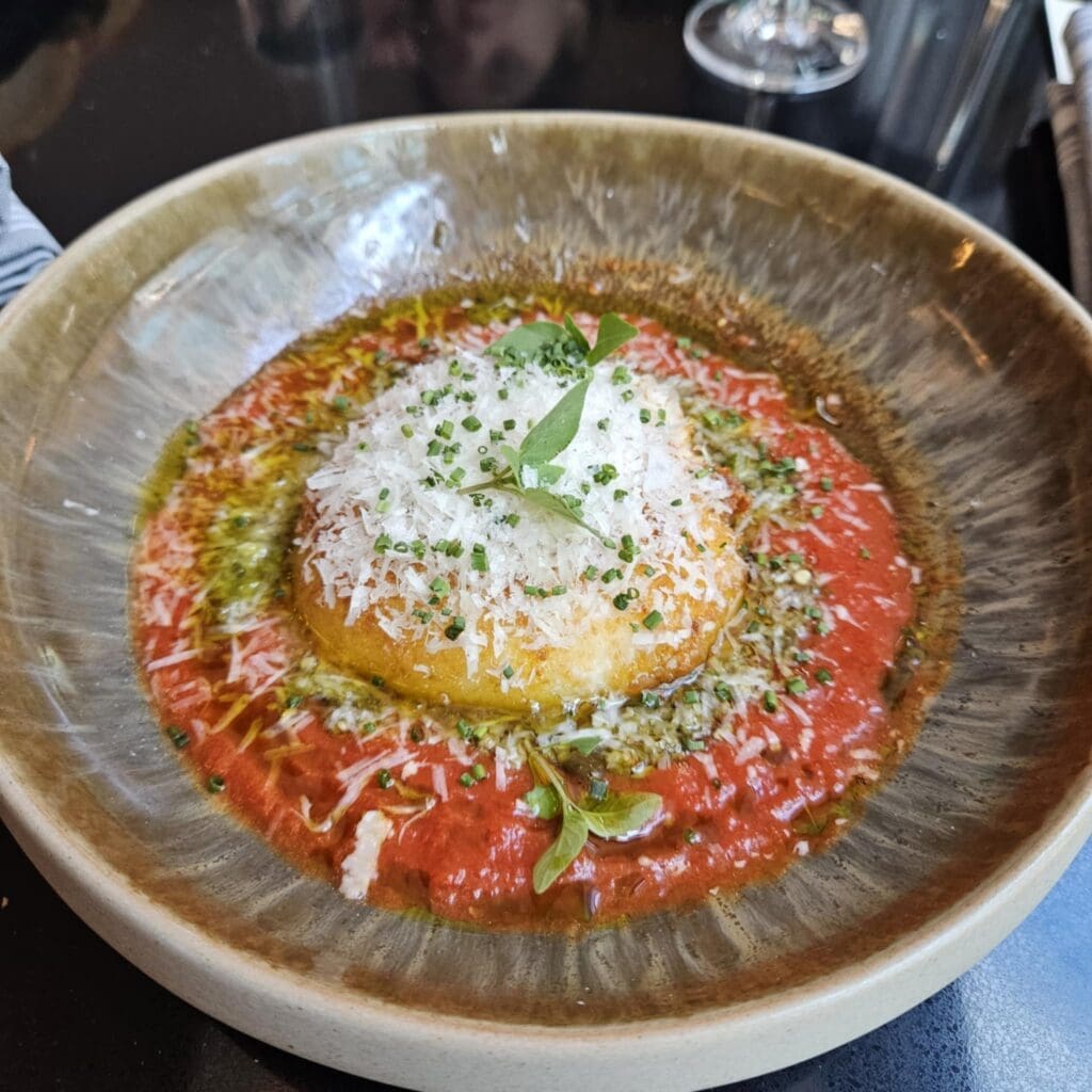 Duchess’s Fried Burrata blends rich cheese with bright tomato butter and a punchy citrus-olive relish. (Photo by Edward Brown)