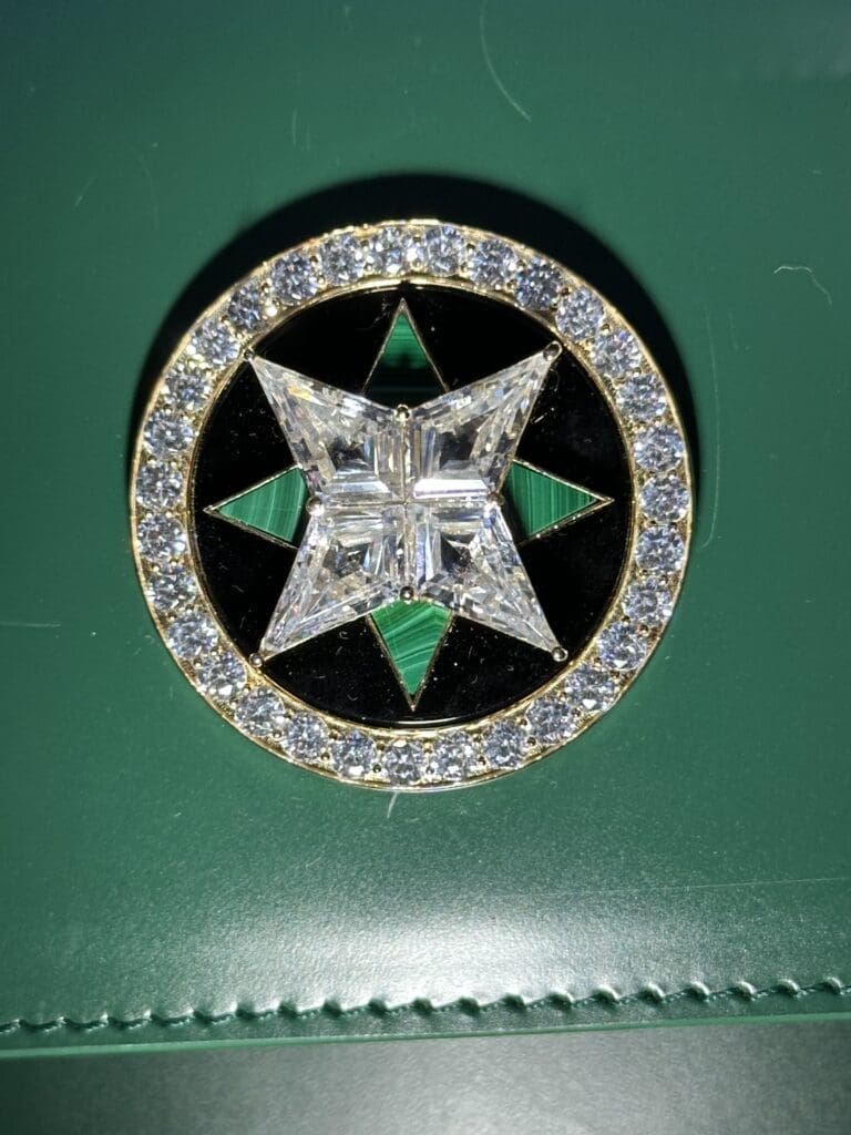 The magnificent diamond and malachite medallion can be ordered on any of the 11 Juillet bags.
