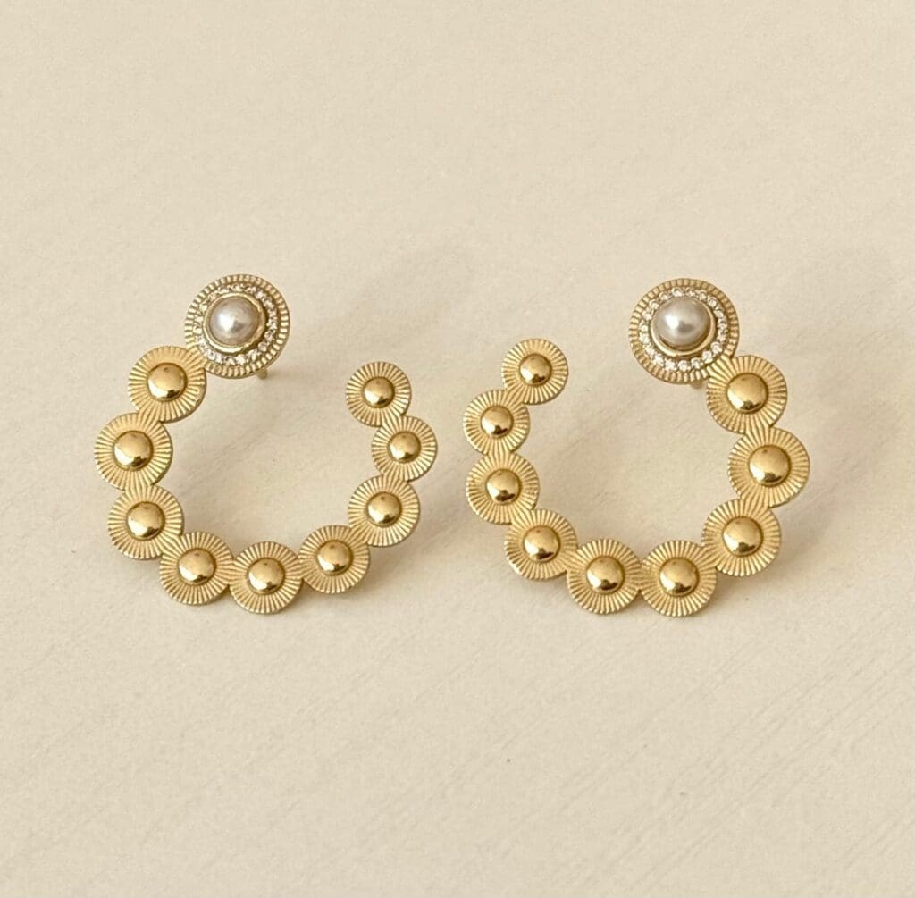 Sunbeam Crescent Pearl Earring, $2,250. 
