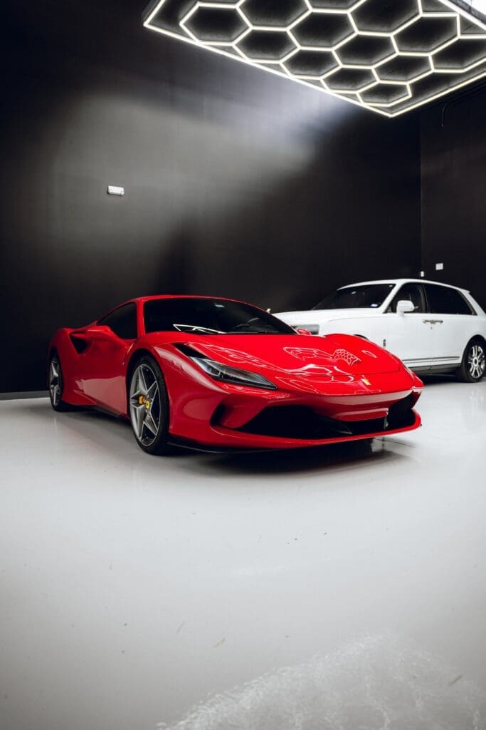 One of Luxe AF Motors’ striking red exotics is parked and ready for its next outing. (Photo courtesy Luxe AF Motors)