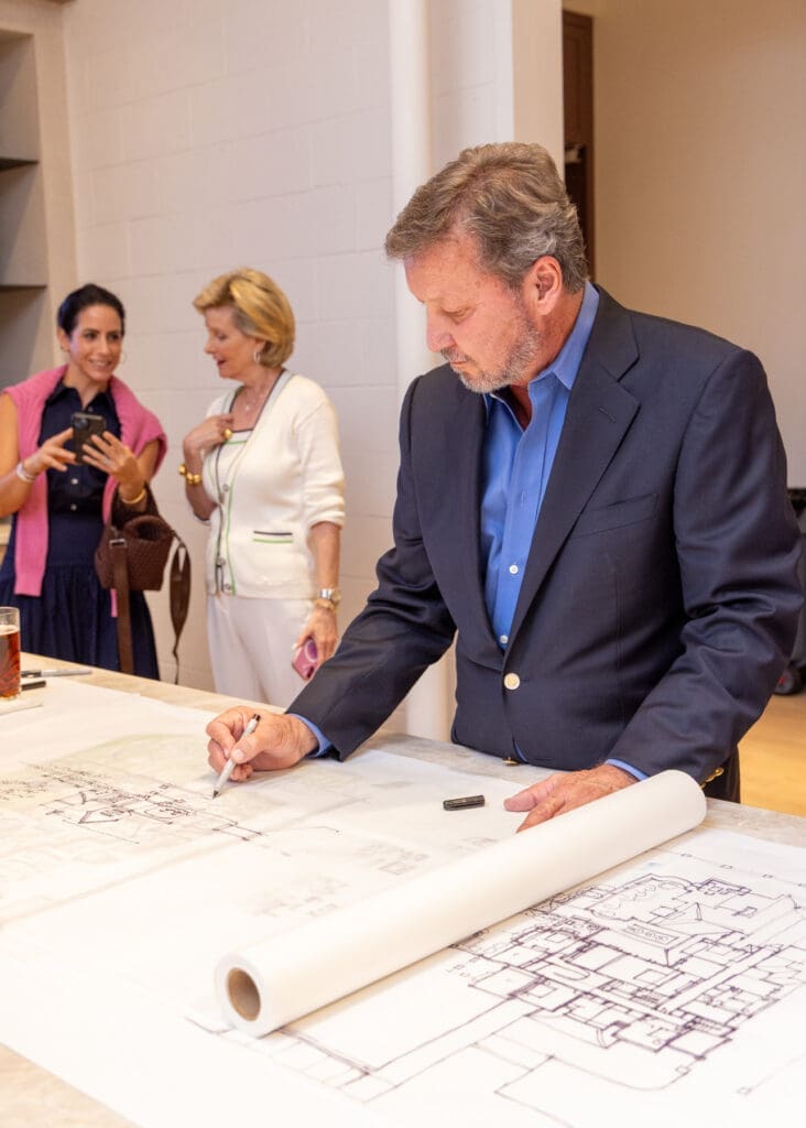 Rodney Stevens sketching a home during the Frankel Design Build showroom reveal party (Photo by Chloe Kissner)